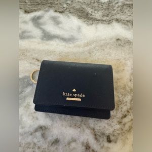 Kate spade navy blue wallet/ light pink interior. Never used before.